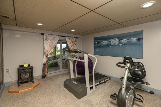40536 Ryans Bay Rd, Zumbro Twp, MN 55991 - workout area featuring a wood stove, recessed lighting, and carpet floors