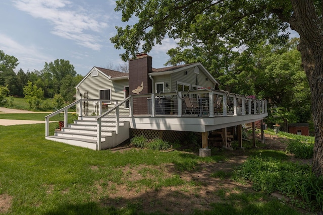 40536 Ryans Bay Rd, Zumbro Twp, MN 55991 - rear view of property with a chimney, a lawn, stairway, and a deck