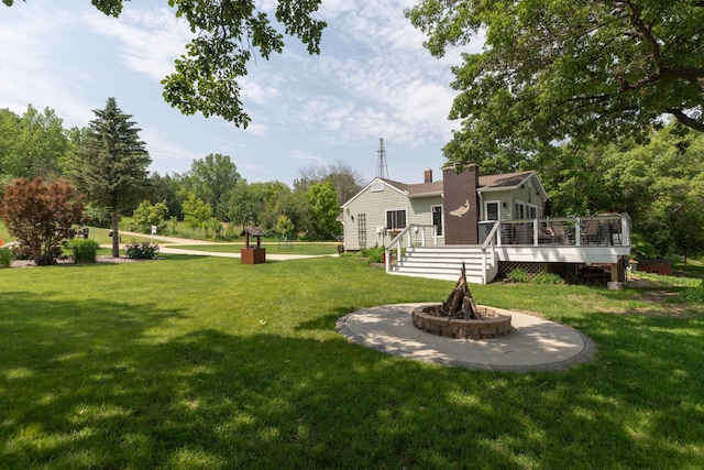 40536 Ryans Bay Rd, Zumbro Twp, MN 55991 - view of grassy yard with an outdoor fire pit and a deck
