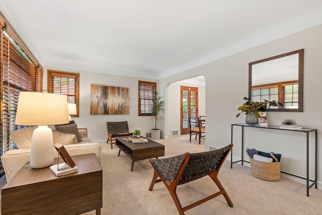 2709 Ewing Ave N, Robbinsdale, MN 55422 - living room with arched walkways and light colored carpet