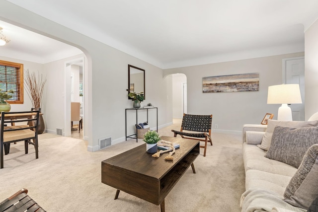 2709 Ewing Ave N, Robbinsdale, MN 55422 - living room with arched walkways and light carpet