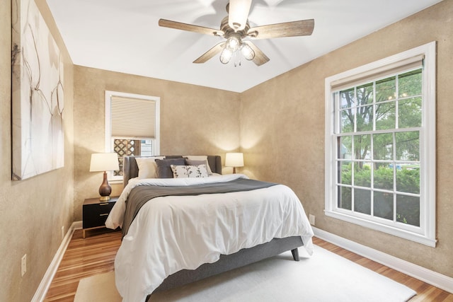 2709 Ewing Ave N, Robbinsdale, MN 55422 - bedroom featuring wood finished floors and ceiling fan