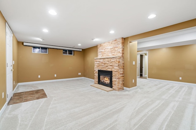2709 Ewing Ave N, Robbinsdale, MN 55422 - unfurnished living room featuring carpet flooring, a stone fireplace, and recessed lighting