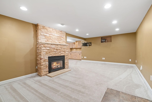 2709 Ewing Ave N, Robbinsdale, MN 55422 - unfurnished living room with light colored carpet, a stone fireplace, and recessed lighting