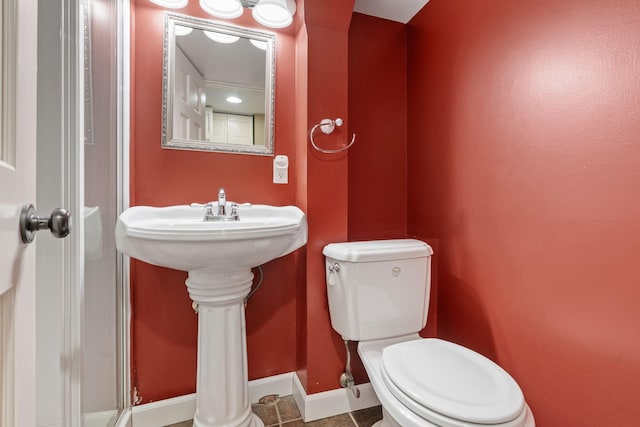 2709 Ewing Ave N, Robbinsdale, MN 55422 - bathroom with toilet and tile patterned floors