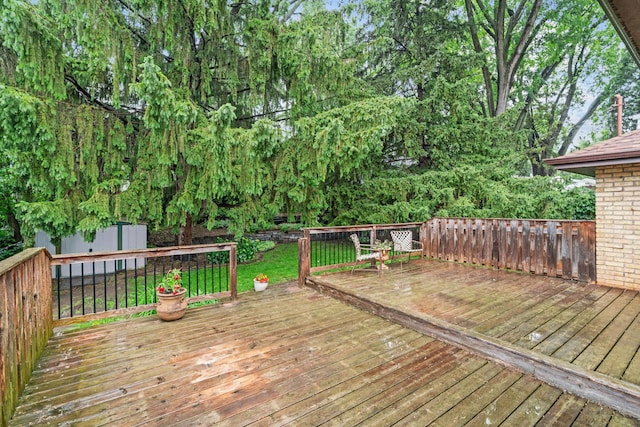2709 Ewing Ave N, Robbinsdale, MN 55422 - wooden deck with an outbuilding
