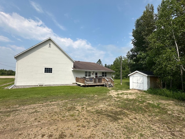 200 Park Ave, Williams, MN 56686 - back of property featuring a storage unit, a wooden deck, and a yard