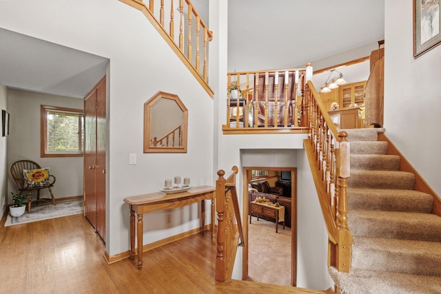 13048 Jay St NW, Coon Rapids, MN 55448 - stairs featuring wood finished floors and baseboards