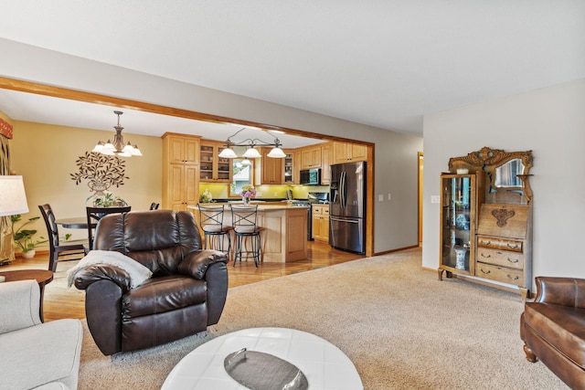 13048 Jay St NW, Coon Rapids, MN 55448 - living room featuring a chandelier and light carpet