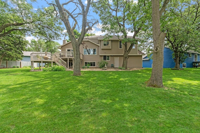 13048 Jay St NW, Coon Rapids, MN 55448 - rear view of house featuring stairway, a wooden deck, and a chimney