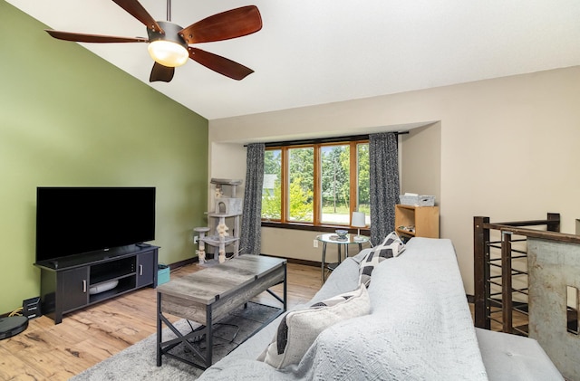 204 Sidney St E, Morristown, MN 55052 - living area featuring vaulted ceiling, a ceiling fan, and wood finished floors