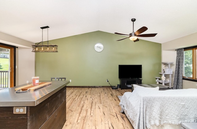 204 Sidney St E, Morristown, MN 55052 - living room featuring vaulted ceiling, a ceiling fan, and light wood finished floors