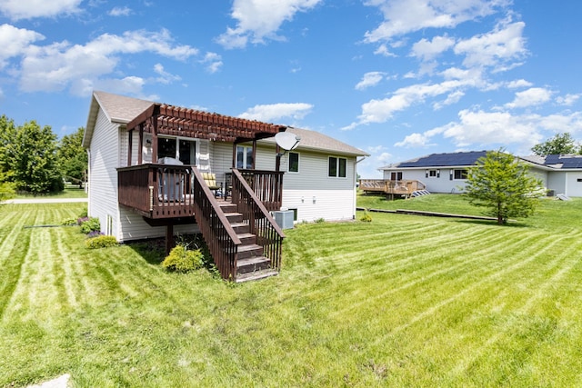 204 Sidney St E, Morristown, MN 55052 - back of house with a pergola, a wooden deck, a yard, and stairs