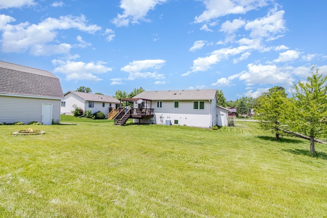 204 Sidney St E, Morristown, MN 55052 - back of property featuring stairs, a fire pit, a deck, and a yard