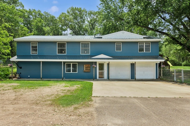 2796 269th Ave NE, Isanti, MN 55040 - view of front facade with concrete driveway, a metal roof, and an attached garage