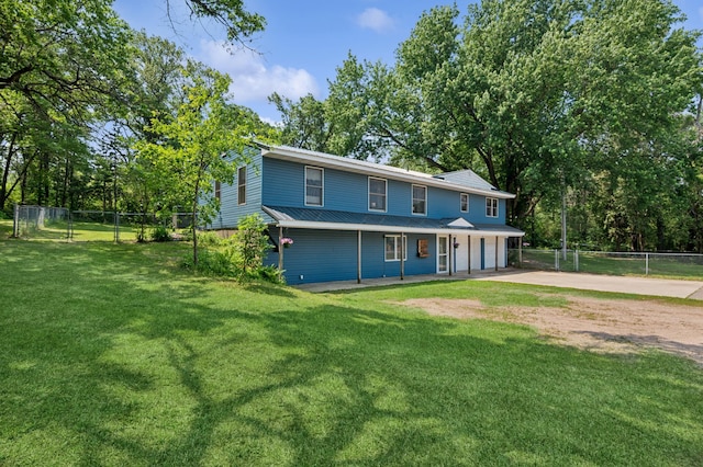 2796 269th Ave NE, Isanti, MN 55040 - view of front of home featuring driveway, an attached garage, covered porch, and view of scattered trees