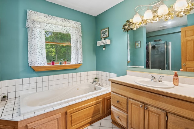 2796 269th Ave NE, Isanti, MN 55040 - bathroom with a shower stall, a bath, vanity, tile patterned flooring, and a chandelier