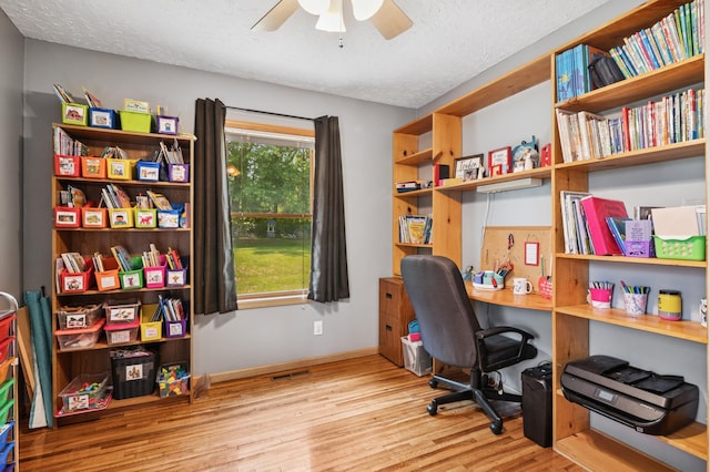 2796 269th Ave NE, Isanti, MN 55040 - office space featuring wood finished floors, ceiling fan, and a textured ceiling