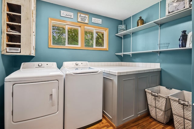 2796 269th Ave NE, Isanti, MN 55040 - laundry room featuring washing machine and dryer and wood finished floors
