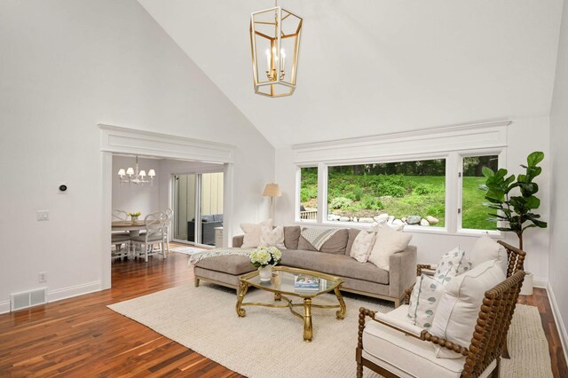 5713 Duncan Ln, Edina, MN 55436 - living area featuring a chandelier, high vaulted ceiling, and wood finished floors