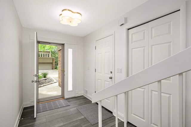5713 Duncan Ln, Edina, MN 55436 - foyer with baseboards and dark wood finished floors