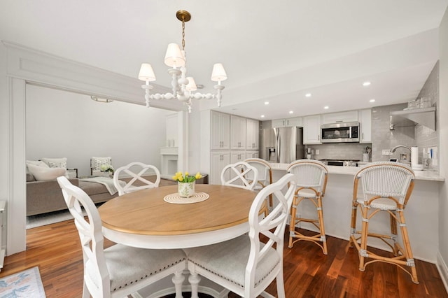 5713 Duncan Ln, Edina, MN 55436 - dining room featuring dark wood-style floors, a chandelier, and recessed lighting