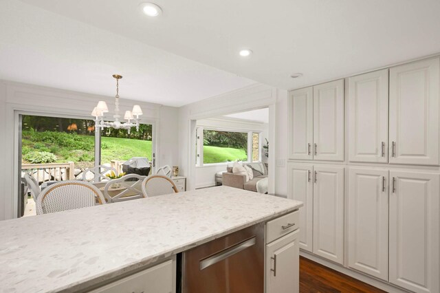 5713 Duncan Ln, Edina, MN 55436 - kitchen with white cabinets, stainless steel dishwasher, light stone countertops, pendant lighting, and recessed lighting