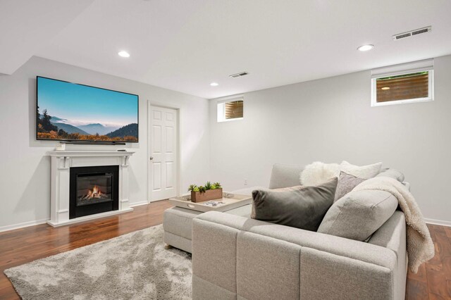 5713 Duncan Ln, Edina, MN 55436 - living area with wood finished floors, recessed lighting, and a glass covered fireplace