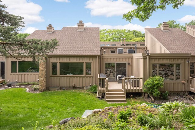 5713 Duncan Ln, Edina, MN 55436 - rear view of property featuring a shingled roof, a deck, a chimney, and board and batten siding