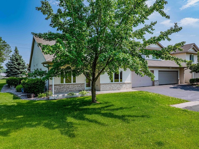 1152 Crystal Pl W, Chaska, MN 55318 - view of property hidden behind natural elements featuring driveway, brick siding, a front lawn, an attached garage, and a shingled roof