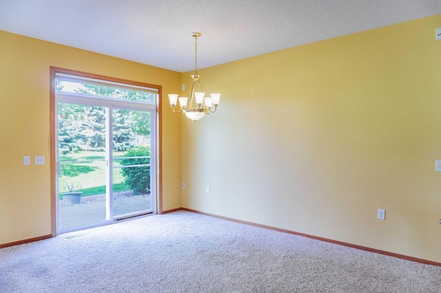 1152 Crystal Pl W, Chaska, MN 55318 - carpeted empty room featuring a chandelier and baseboards