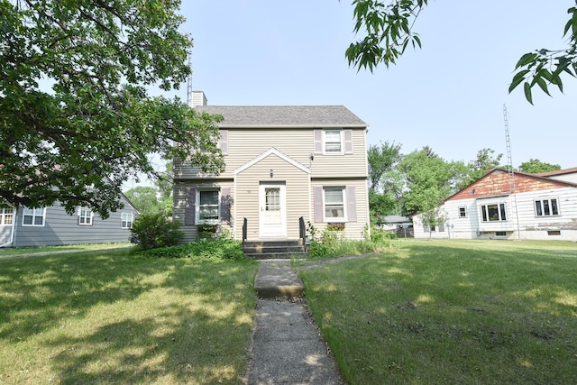 145 Riverside Dr, Stephen, MN 56757 - colonial inspired home with a front yard and a chimney