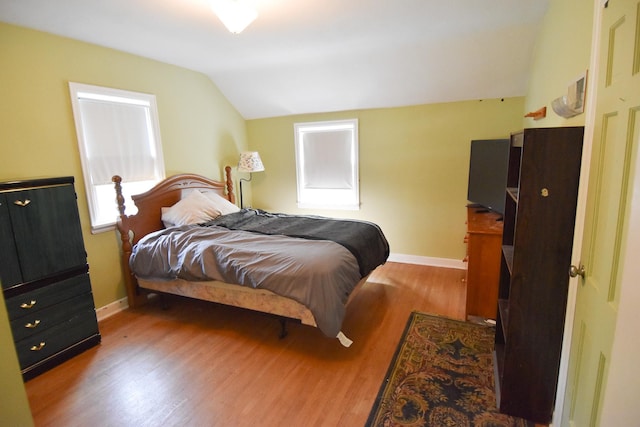 145 Riverside Dr, Stephen, MN 56757 - bedroom featuring vaulted ceiling and wood finished floors