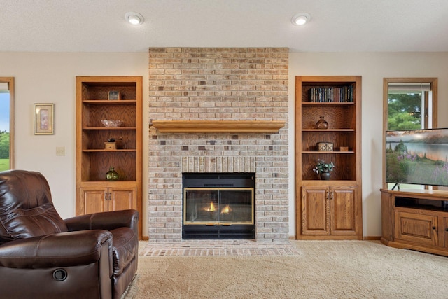 2771 County Line Ave, Osceola, WI 54020 - carpeted living area featuring built in shelves and a brick fireplace