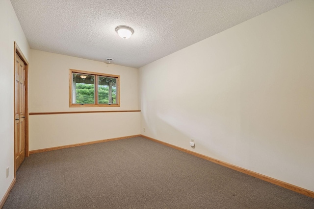 2771 County Line Ave, Osceola, WI 54020 - carpeted empty room featuring a textured ceiling and baseboards