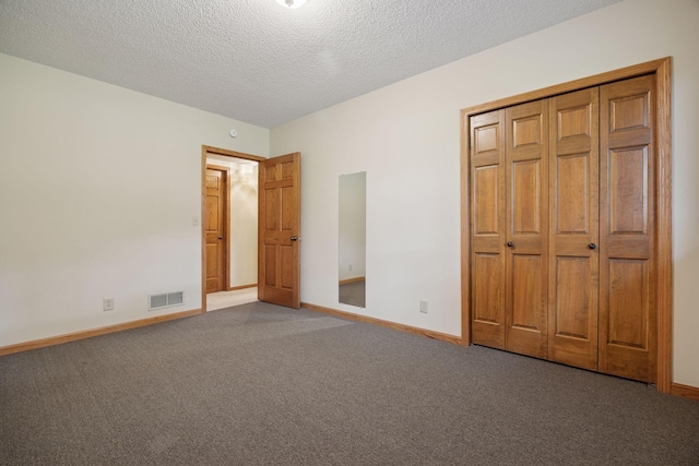2771 County Line Ave, Osceola, WI 54020 - unfurnished bedroom featuring carpet floors, a textured ceiling, and a closet