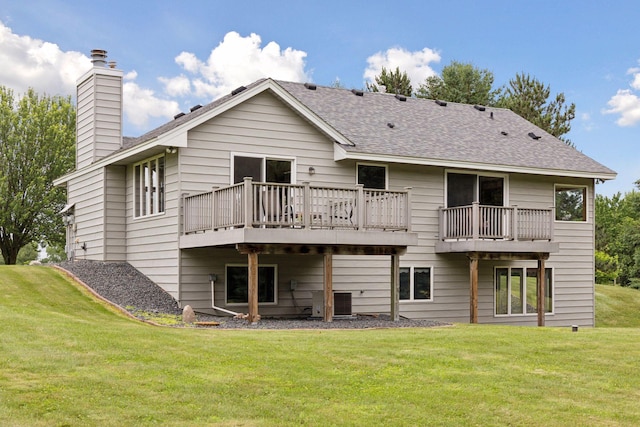 2771 County Line Ave, Osceola, WI 54020 - rear view of house featuring a chimney, a lawn, roof with shingles, and a wooden deck