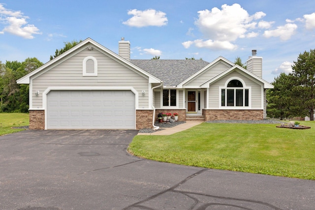 2771 County Line Ave, Osceola, WI 54020 - single story home with brick siding, a chimney, driveway, and a front yard