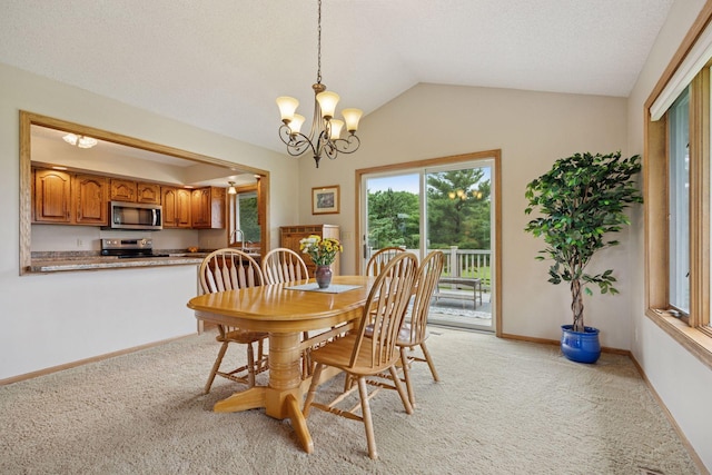 2771 County Line Ave, Osceola, WI 54020 - dining area featuring light colored carpet, a chandelier, and lofted ceiling