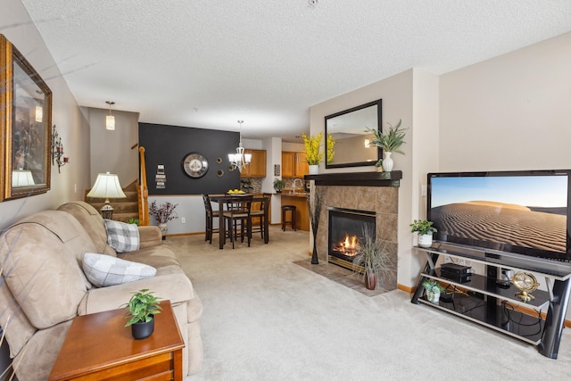 3307 Coleshire Path Unit 14, Rosemount, MN 55068 - carpeted living area featuring a textured ceiling, a chandelier, and a fireplace