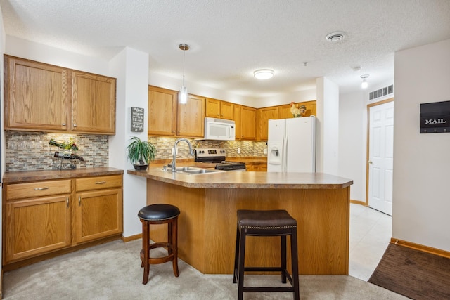 3307 Coleshire Path Unit 14, Rosemount, MN 55068 - kitchen featuring white appliances, a kitchen breakfast bar, backsplash, a textured ceiling, and hanging light fixtures