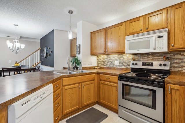 3307 Coleshire Path Unit 14, Rosemount, MN 55068 - kitchen with white appliances, a chandelier, dark countertops, backsplash, and a textured ceiling