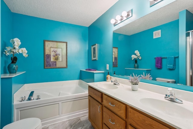 3307 Coleshire Path Unit 14, Rosemount, MN 55068 - full bathroom with a textured ceiling, a garden tub, double vanity, and a shower with door