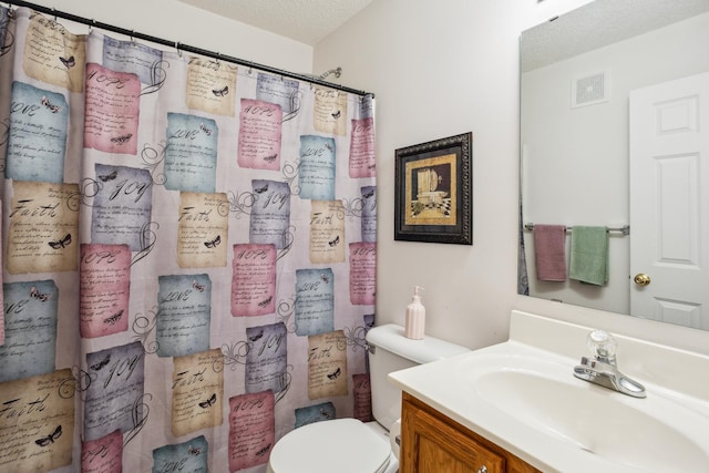 3307 Coleshire Path Unit 14, Rosemount, MN 55068 - bathroom featuring vanity, a shower with shower curtain, and a textured ceiling