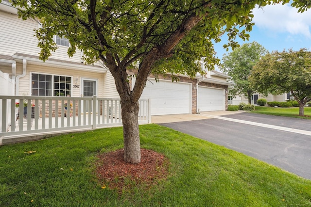 3307 Coleshire Path Unit 14, Rosemount, MN 55068 - obstructed view of property featuring driveway and a front lawn