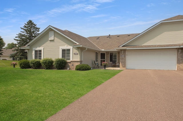 18566 Gladstone Blvd N, Maple Grove, MN 55311 - single story home featuring brick siding, asphalt driveway, a front yard, and a shingled roof