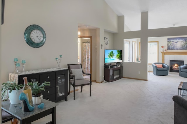 18566 Gladstone Blvd N, Maple Grove, MN 55311 - carpeted living room featuring a tiled fireplace and high vaulted ceiling