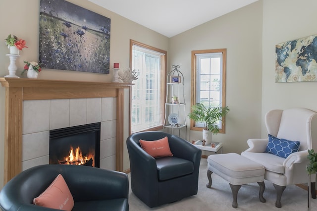 18566 Gladstone Blvd N, Maple Grove, MN 55311 - living area with a fireplace, lofted ceiling, and carpet