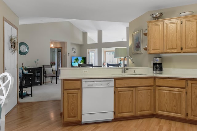 18566 Gladstone Blvd N, Maple Grove, MN 55311 - kitchen with white dishwasher, a peninsula, light countertops, light wood finished floors, and vaulted ceiling