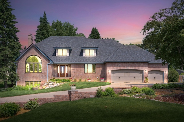 11428 Zion Cir S, Bloomington, MN 55437 - view of front facade with a lawn, brick siding, an attached garage, concrete driveway, and a chimney